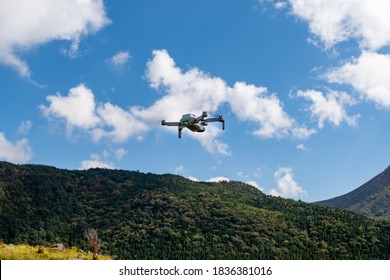 
Drone hovering against the backdrop of the mountains of Kokonoe Town, Oita Prefecture