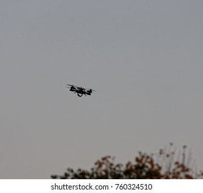 Drone hovering in the sky during sunset