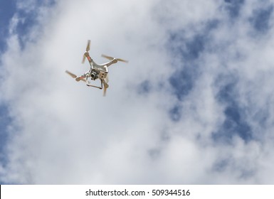 Drone hovering in the whitesky.