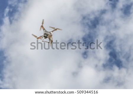 Drone hovering in the whitesky.