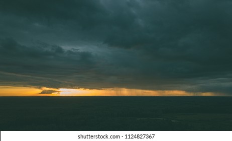 Drone Image. Aerial View Of Rural Area With Houses And Roads Under Heavy And Dark Dramatic Rain Clouds In Summer Day. Night Photo. Latvia - Vintage Retro Look