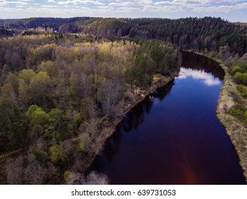 drone image. aerial view of rural area with river and broken cloud shadows on the forests - Shutterstock ID 639731053
