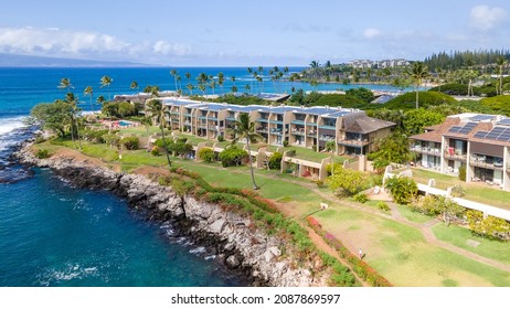 Drone image of a condo complex right on the shoreline in paradise