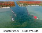 A drone image of a lighthouse in Sturgeon Bay Door County Wisconsin during fall and autumn colors.