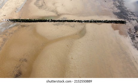 Drone Image Looking Down Onto A Sandy Beach. Taken In Lancashire England. 