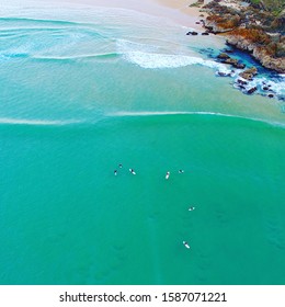 Drone image of surfers waiting for a wave in Australia