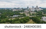 Drone Images of Downtown Raleigh North Carolina featuring the Skyline and Dorothea Dix Park on a Cloudy Day. Travel, Business, Tourism, Growth, Development