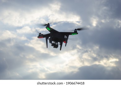 Drone on the background of a blue cloudy sky.