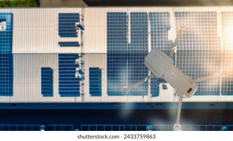 Drone over construction site. Energy Engineer using Drone Technology for inspection work of Solar Panel installation - Powered by Shutterstock