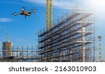 	
Drone over construction site. video surveillance or industrial inspection	
