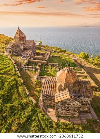 Drone panorama of Sevanavank Monastery and chapel overlooking famous Sevan lake at sunny spring day. Travel and tourist destinations of Armenia