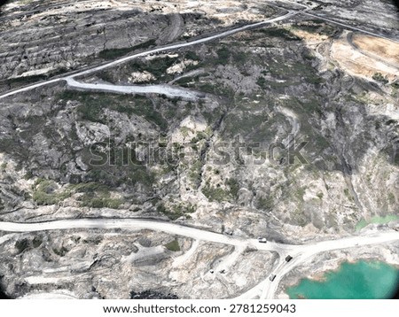 Drone Perspective of Industrial Mining Infrastructure and Overburden Removal Area Bordering Tropical Forest