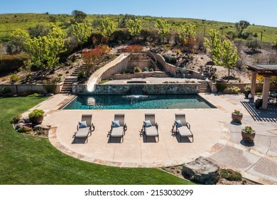 Drone Photo the Beautiful Pool and Pool Deck with Waterslide, Chairs, Landscaping, and Lawn on a 75 Acre, Sonoma Wine Country Estate, Horse Property