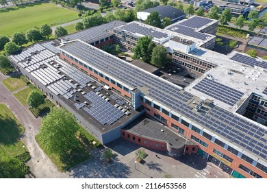 Drone Photo Of A Large School Building For Vmbo, Mavo ,havo And Vwo Education.
1100 Solar Panels Have Been Installed On The Roof Of This School For Green Energy.