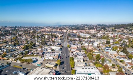 Drone photo looking down San Pablo Ave in San Pablo, California with blue skies and city streets