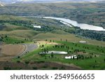 drone photo taken from Lewiston ID looking across three golf courses, a marina and the Snake River into Washington between Clarkston and Asotin