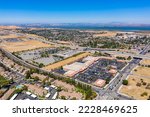 Drone photograph of the BART station in Pittsburg, California on a beautiful blue sky day. 
