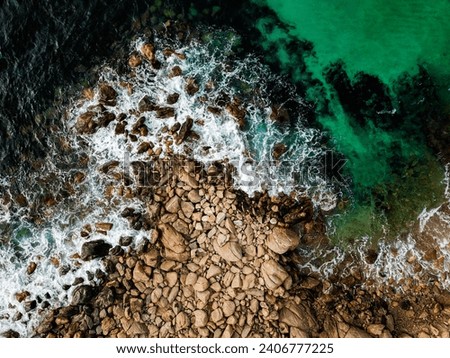 Similar – Aerial Drone View Of Dramatic Ocean Waves Crushing On Rocky Landscape