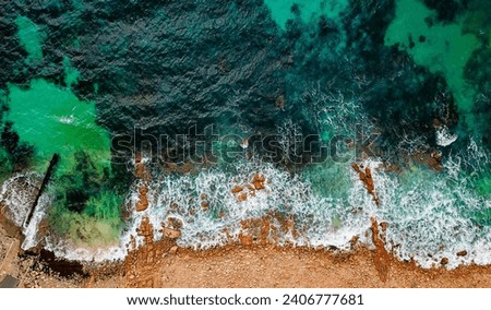 Similar – Aerial Drone View Of Dramatic Ocean Waves Crushing On Rocky Landscape