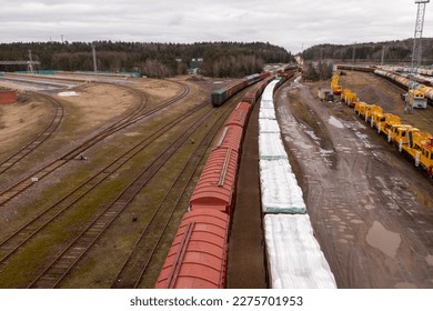 Drone photography of railway depot, cargo carriages and train during winter cloudy day - Shutterstock ID 2275701953