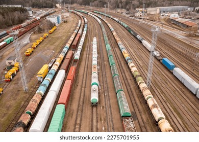 Drone photography of railway depot, cargo carriages and train during winter cloudy day - Shutterstock ID 2275701955