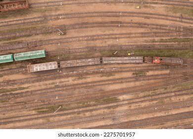 Drone photography of railway depot, cargo carriages and train during winter cloudy day - Shutterstock ID 2275701957