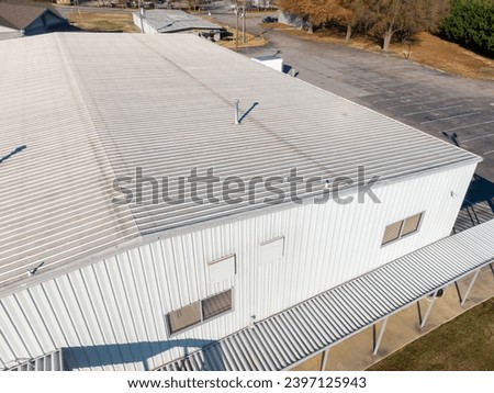 Drone Photos of Commercial Roofs Featuring Shingles and Metal in Unique Shapes and Large Surface Area. 