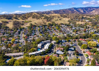 Drone photos over Vacaville, California during the fall with colorful trees and hills