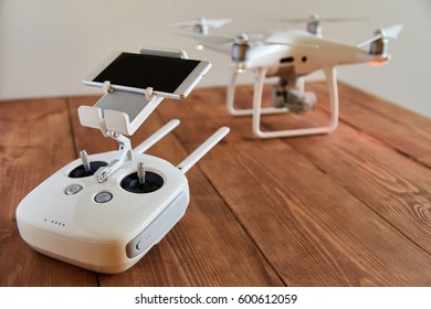 Drone quadcopter with a flight controller on the old wooden background with a copy space. side view.