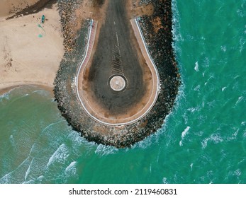 Drone Shot Aerial View Top Angle Beautiful Photo Of Dhanuskodi End Point Of India Tamilnadu Tourist Spot Turquoise Blue Ocean Water Circular Shaped Road Ending At Sea Waves Crashing Gravel No People 