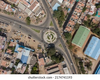 Drone Shot Aerial View Top Angle Bright Sunny Day Overhead Photo Of City Traffic Roads Crossover Junction Circular Roundabout Green Grass India Tamilnadu Madurai 