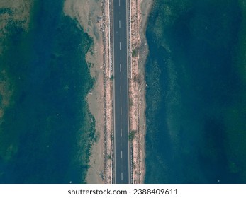 drone shot aerial view top angle panoramic photograph of highway through coastal area dhanushkodi rameswaram tamilnadu india arichalmanai tourism wallpaper Beach seawave seascape Island turquoise blue - Powered by Shutterstock