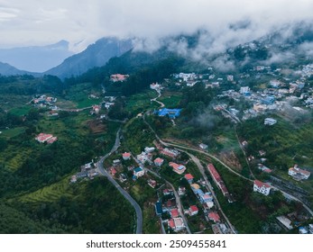 drone shot aerial view top angle panoramic photograph mountain village houses tribal settlement  landscape hill valley cloudy misty rainforest scenery wallpaper india kodaikanal ooty step cultivation  - Powered by Shutterstock