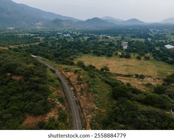 drone shot aerial view top angle panoramic photograph agricultural landscape fields vegetation plantation trees mountain plateau hilly terrain plains slope greenery rainforest india Kerala tamilnadu  - Powered by Shutterstock