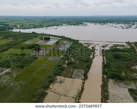 drone shot aerial view top angle panoramic photograph of dam reservoir river flooding overflowing erosion alluvial soil agricultural fields fertile cultivation india tamilnadu swamp cloudy wallpaper 