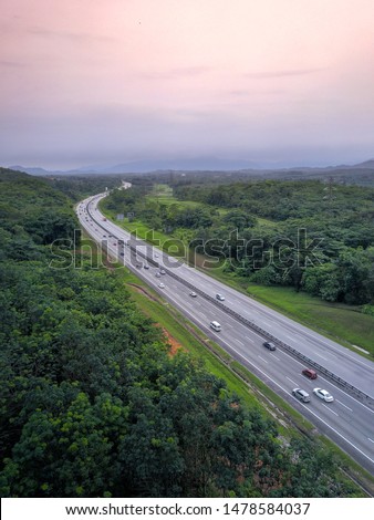 Drone shot of a beautiful highway in Malaysia PLUS Highway over nice sunset scenery in dusk