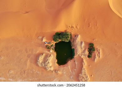 Drone Shot Of A Beautiful Lake In The Dune Of Saudi Arabia Desert 