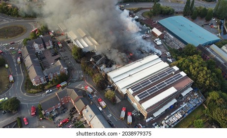 A Drone shot of a building on fire in Kidderminster, UK. High quality large warehouse fire in urban area. - Shutterstock ID 2038979375