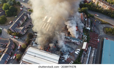A Drone shot of a building on fire in Kidderminster, UK. High quality large warehouse fire in urban area. - Shutterstock ID 2038979378