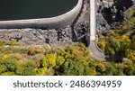 A drone shot of Croton Gorge Park and dam on a sunny day in autumn