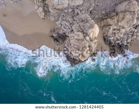 Similar – Aerial Drone View Of Dramatic Ocean Waves Crushing On Rocky Landscape