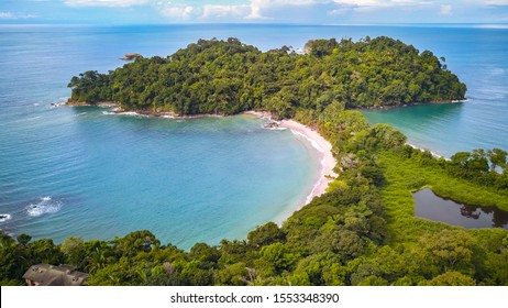 Drone Shot Of Manuel Antonio Beach Near Quepos In Puntarenas. The Best National Park In Costa Rica With The Highest Biodiversity And Lots Of Animals, Wildlife, Tropical Plants And Beautiful Beaches.