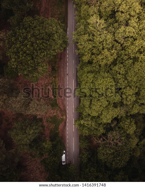 Drone shot of a rural road through Delamere forest,\
Frodsham, May 2019