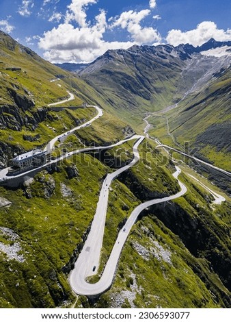 A drone shot of Swiss Mountain Roads, The Furka Pass and Susten Pass next to the Rhone Glacier