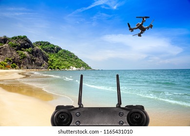 Drone Technology Is controlled by remote control concept . Pocket spy Foldable Drone quadrocopter, with high resolution digital camera flying aerial over spectacular at The beach During travel .