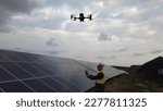 Drone thermal with a tecnician at photovoltaic solar field