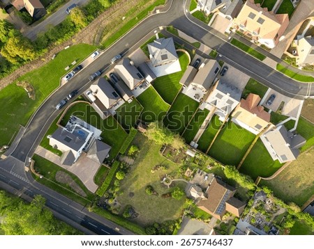 Drone top down view of brand new homes, some of which owners have moved into the properties. Both detached and more affordable semi detached homes can be seen here, in late summer.