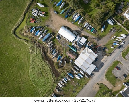 Drone top down view of a large dry dock and boat yard repair area. Located on the Suffolk, UK, coastline.