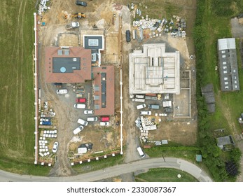 Drone top down view of a pair of very large detached houses seen quiet late in there stage of development.