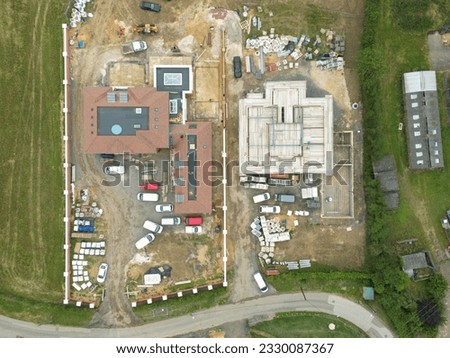 Drone top down view of a pair of very large detached houses seen quiet late in there stage of development.